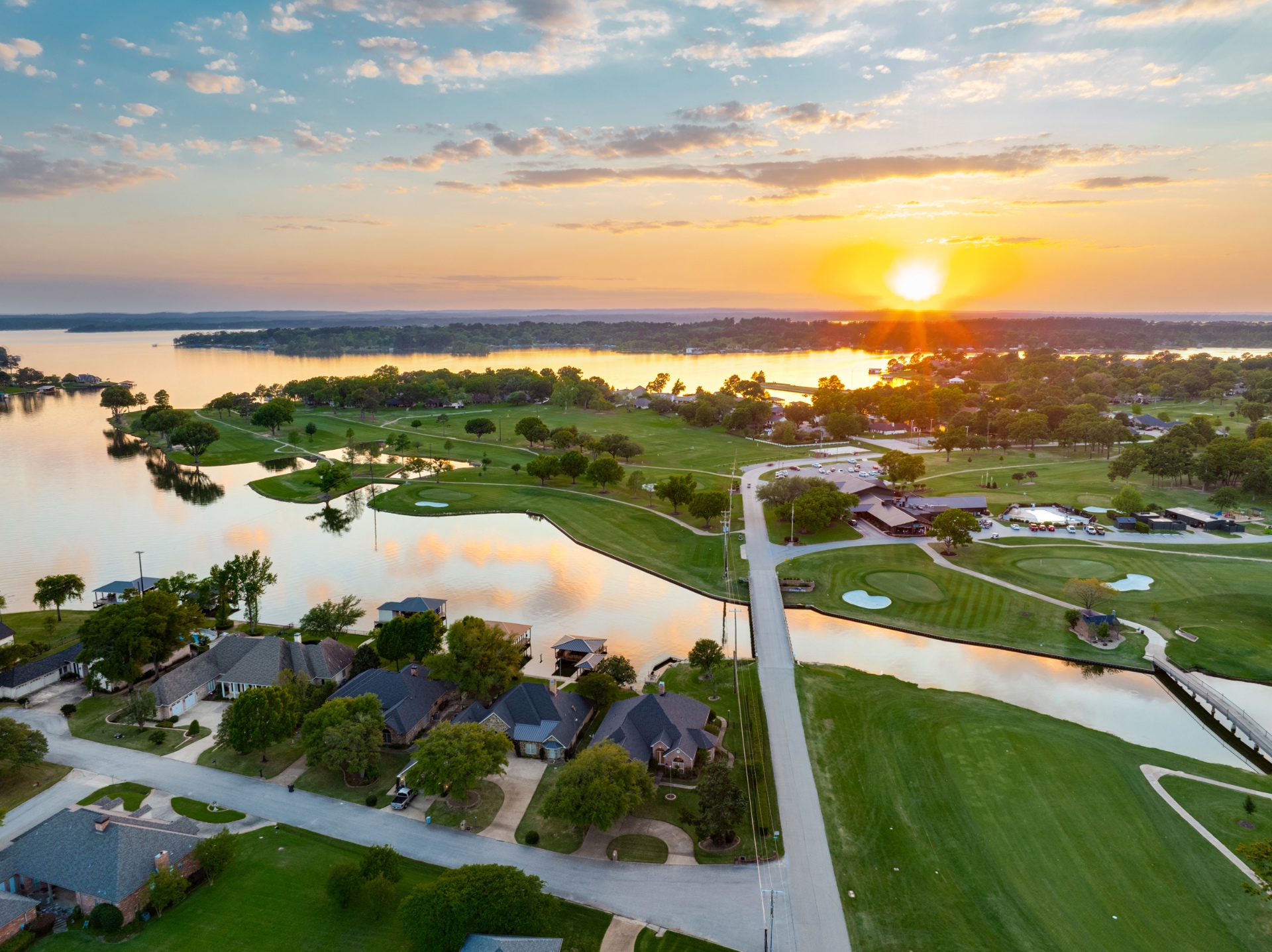 Aerial view of Emerald Bay community, lake and golf course